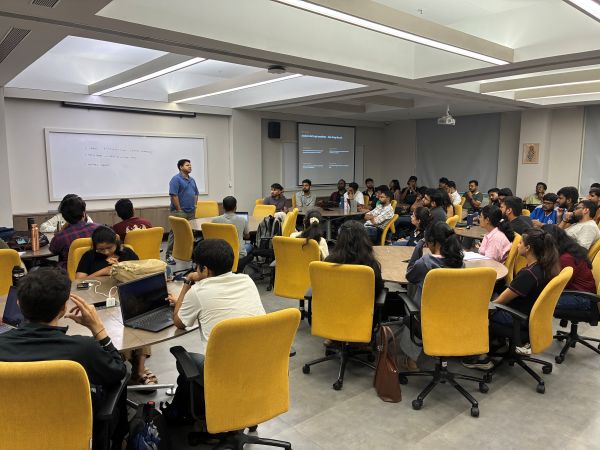Meeting room with speaker and attendees.
